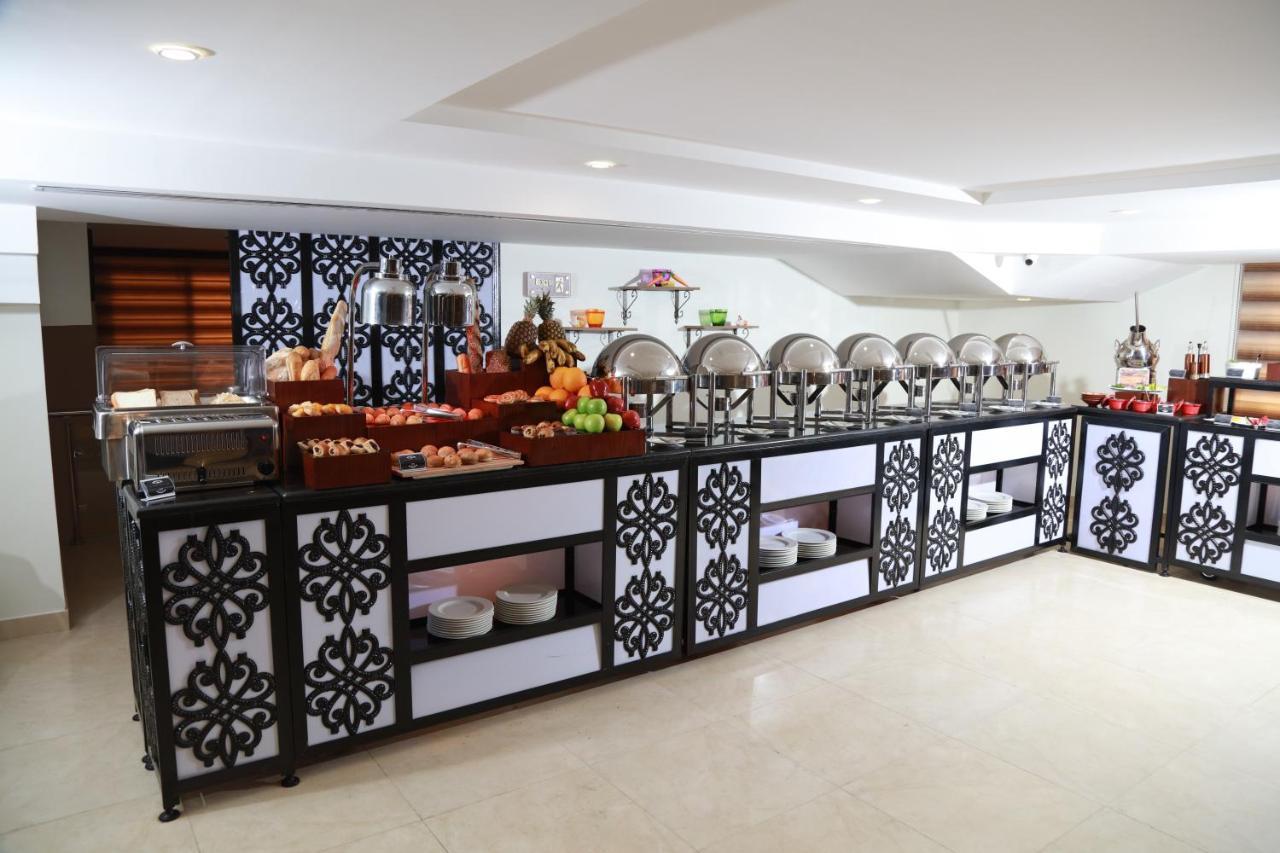 Rawa Hotel Suites Аман Екстериор снимка