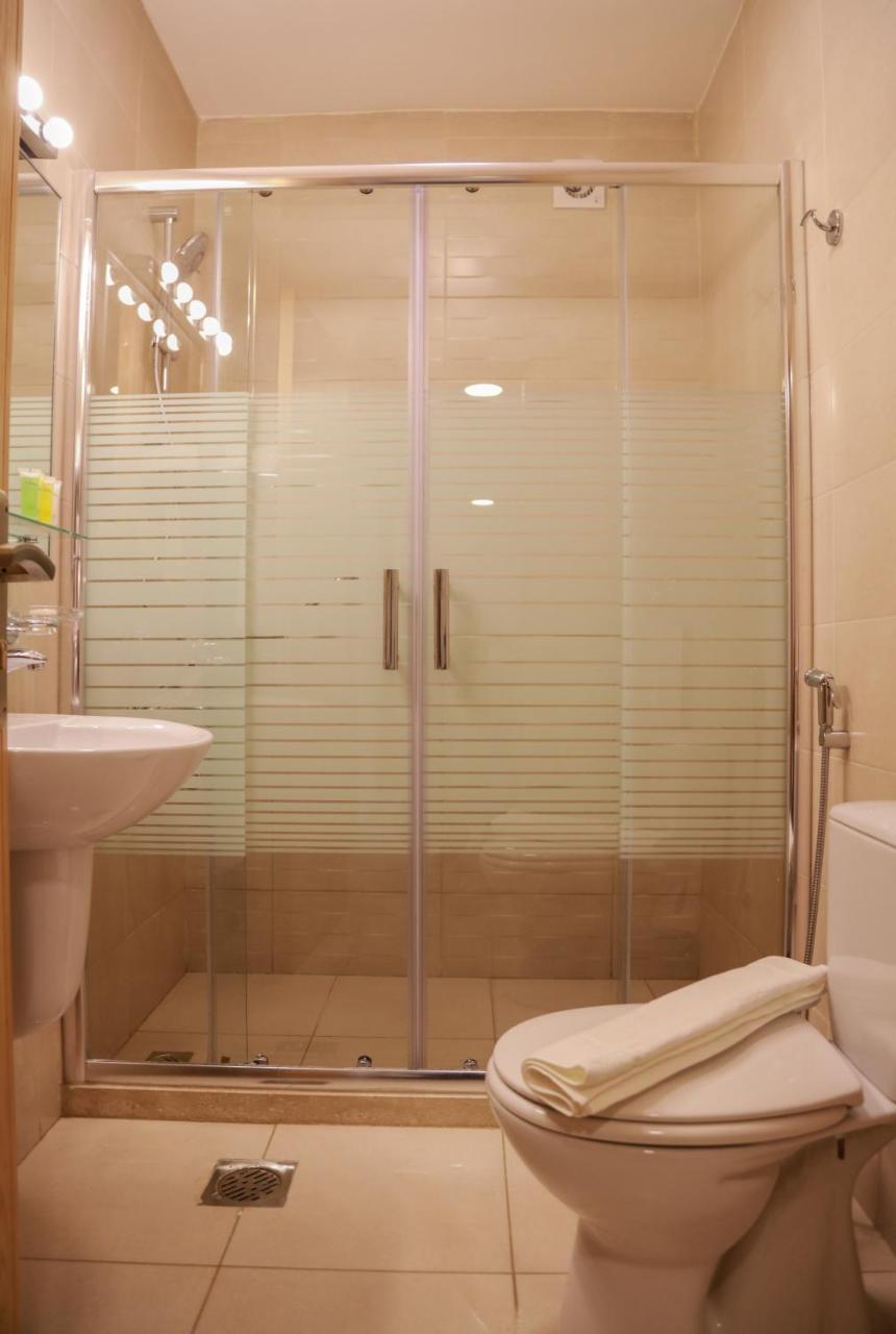 Rawa Hotel Suites Аман Екстериор снимка